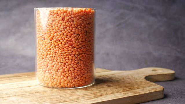  jar of of uncooked dhal on a chopping board 