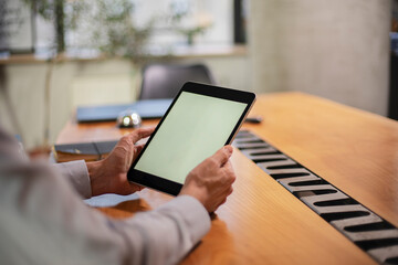 Close up of man using digital tablet.