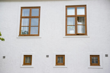 White Wall background with brown windows background texture of house