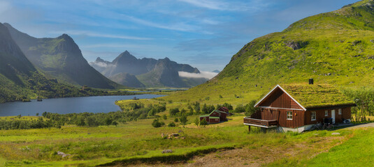 Green spring view of Scandinavia, high mountains in the background, central Norway, near the village of Grotli