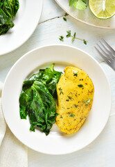 Baked turmeric chicken breast and sauteed spinach