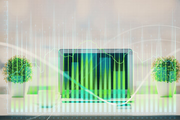 Stock market graph on background with desk and personal computer. Multi exposure. Concept of financial analysis.