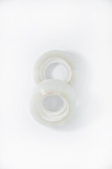 Two rolls of transparent tape on a white background. Adhesive tape. New scotch tape.