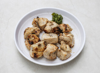 Chicken malai tikka boti served in plate isolated on table top view of indian and pakistani spicy food