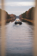 Fototapeta premium A barge on a canal photographed from a bridge