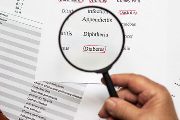 Close up of a senior woman hand medical history questionnaire