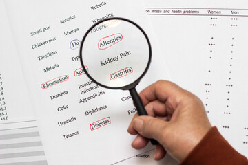 Close up of a senior woman hand medical history questionnaire