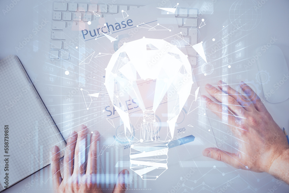Poster View of Bulb lamp idea concept icon on a futuristic interface with writing man's hand background. Double exposure.