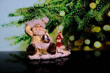 Toy Santa Claus on the background of the Christmas tree