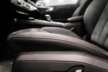 Soft focus close up of black leather driver's seat