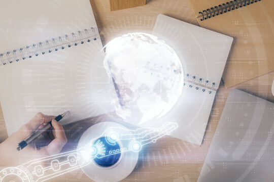 Multi exposure of hands making notes with world map hologram and data theme icons. Concept of global data.