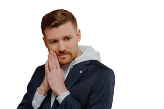 Worried young man wearing stylish casual clothes keeping hands in praying gesture on pink background, guy with hopeless face expression asking for help or making hard decision - Powered by Adobe