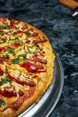 Fresh and juicy pizza close-up. Pizza with cheese and scrambled eggs.