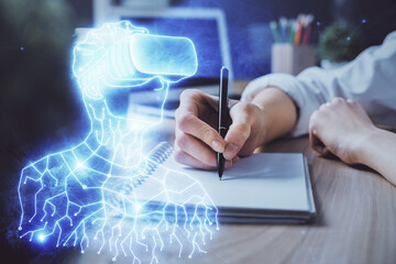 AR hologram over woman's hands taking notes background. Concept of augmented reality. Multi exposure
