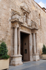 Fototapeta na wymiar Side Entrance, Access Door of San Agustin Church in Valencia, Spain