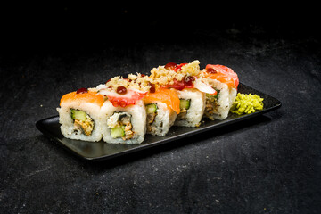 sushi on a black plate