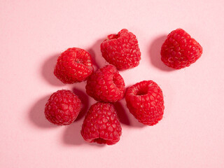 Raspberries on a pink background. Fresh raspberries.