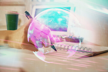 Tech theme hologram over woman's hands taking notes background. Concept of hightech. Double exposure