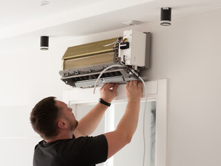 Repair and fix air conditioner at home. Lock down and Self-quarantine at home during the Corona...