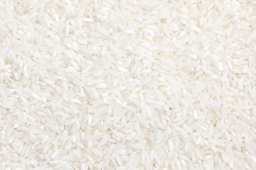 Top view of white rice seed texture background. Organic and natural rice grain, healthy food. Agriculture of culture asian. 