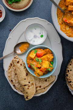 Paneer curry served with Chapati and raita