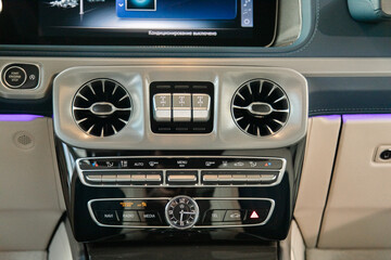 multimedia screen and ventilation system in a well-known expensive premium car with backlight