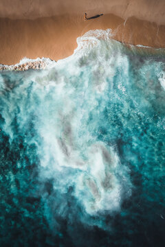 Aerial view of crispy waves along the shoreline at Playa de los Amantes, Cabo San Lucas, Baja California, Mexico.
