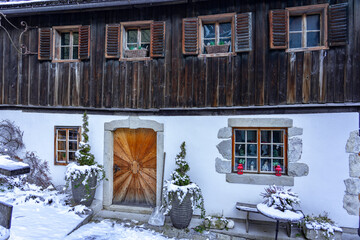 Idillic traditional rustic building exterior in Hallstatt Austria with wooden details