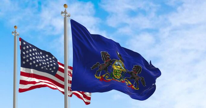 Pennsylvania state flag waving alongside the national flag of the United States