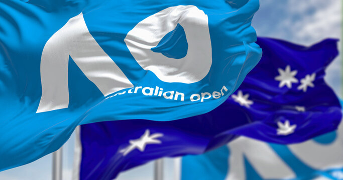 The flag with the Australian Open logo and the national flag of Australia waving together.