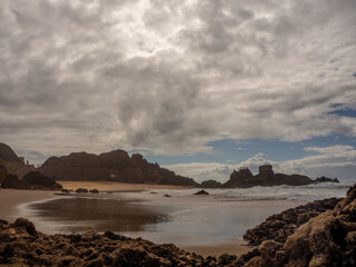 Santa Cruz beach under a sunny but cloudy sky. Santa Cruz – Silveira – Portugal