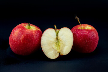 close-up apple on black background