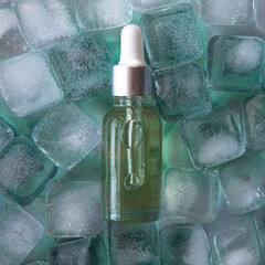 Cosmetic product packaging on menthol ice cubes. Mockup.