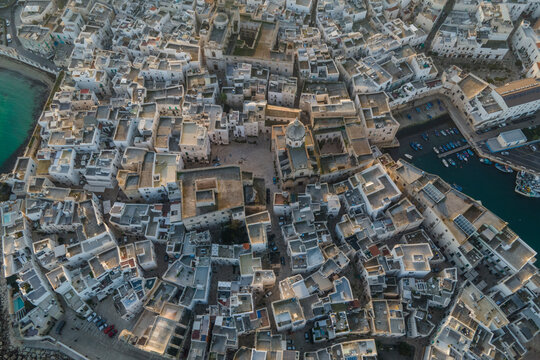 Aerial view of Monopoli old town and Saint Teresa d'Avila church, Bari, Puglia, Italy.