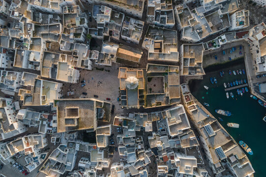Aerial view of Monopoli old town and Saint Teresa d'Avila church, Bari, Puglia, Italy.