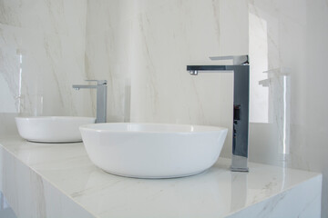 Naklejka na ściany i meble Luxury bathroom sinks with marble top, in a modern bathroom