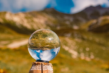 Crystal ball alpine summer landscape shot at the famous Nebelhorn summit near Oberstdorf, Bavaria,...