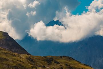 The famous Hoefats summit shrouded in clouds seen from the Nebelhorn summit near Oberstdorf, Bavaria, Germany