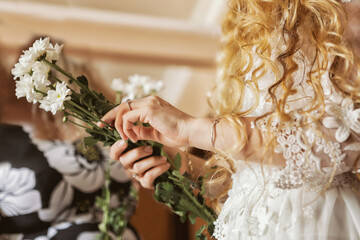 Blonde Bride Holding Her Flowers