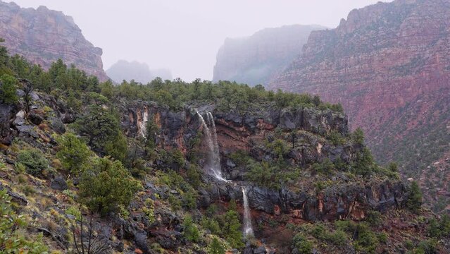 Waterfall created from the heavy rain flowing into Grapevine Wash in Zion National Park.