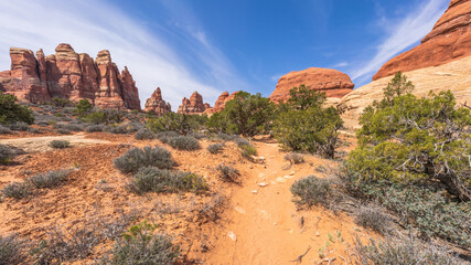 hiking the chesler park loop trail in the needles in canyonlands national park, usa