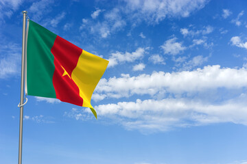 Republic of Cameroon Flag Over Blue Sky Background. 3D Illustration