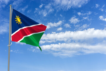 Republic of Namibia Flag Over Blue Sky Background. 3D Illustration