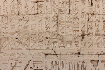 Fototapeta na wymiar Hieroglyphics and reliefs at the Karnak Temple in Luxor, Egypt