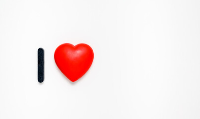 Fototapeta premium I love. Red heart on a white background. Concept of declaration of love and Valentine's day. copy space