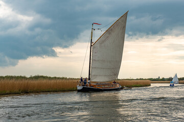 The Norfolk pleasure wherry “Hathor” sailing down the River Bure, Norfolk Broads