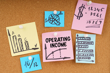 On the board are stickers with graphs and diagrams and the inscription - OPERATING INCOME