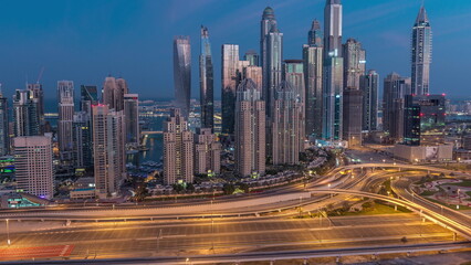 Fototapeta na wymiar Dubai Marina highway intersection spaghetti junction night to day timelapse
