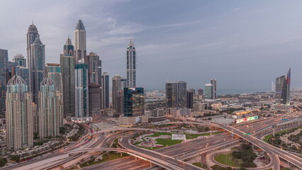 Naklejka na ściany i meble Dubai Marina highway intersection spaghetti junction day to night timelapse