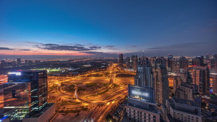Fototapeta na wymiar Huge highway crossroad junction between JLT district and Dubai Marina night to day timelapse.